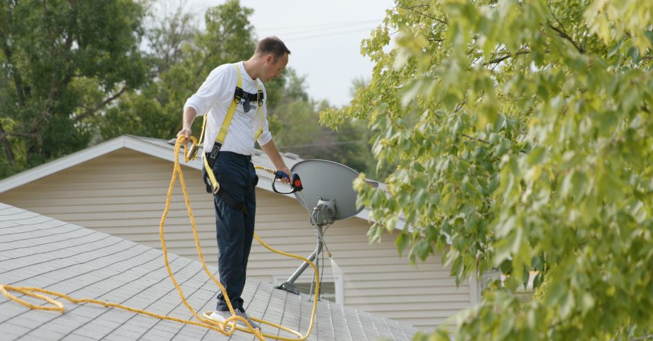 Applicator treating an asphalt shingle roof